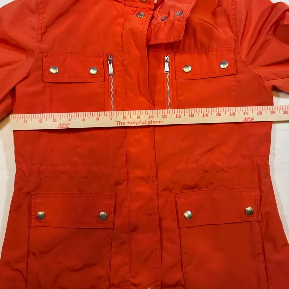 NWOT Michael Kor’s Women's Orange Hooded Rain Coat Jacket with silver details